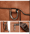 Bolsa masculina tipo maleta em couro plutônio, com alça de mão e ombro